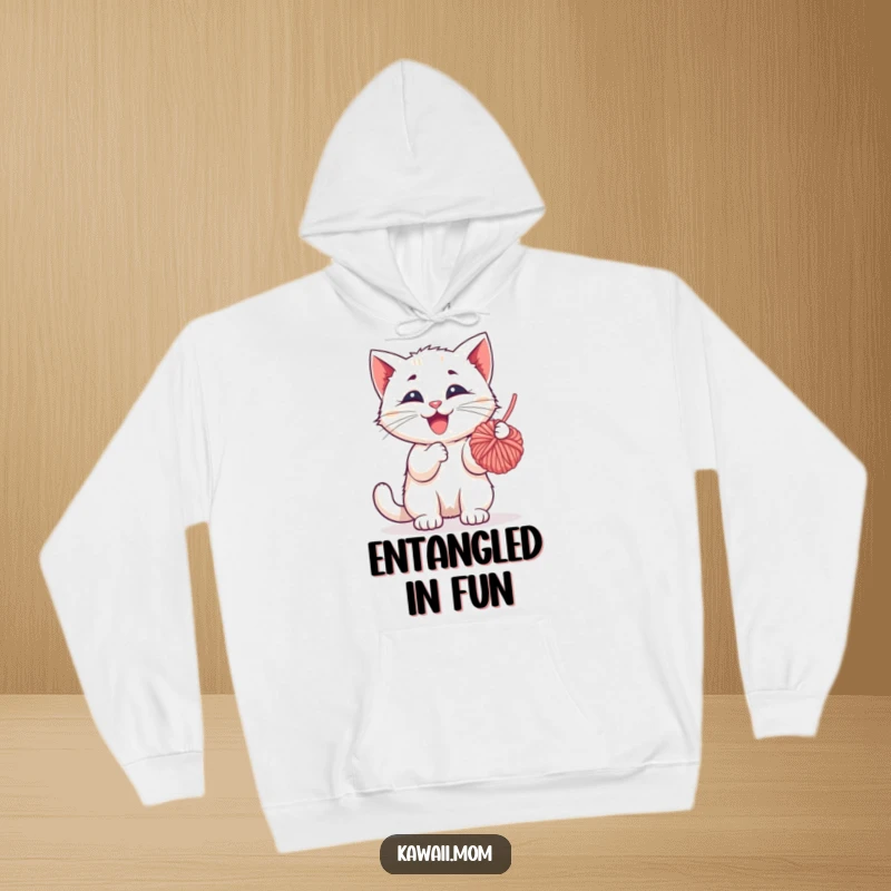 Funny Hoodie: Features a happy kitten character actively batting at a dangling yarn ball, radiating playful energy and cuteness.